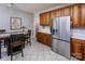 Kitchen features stainless steel refrigerator and ample wood cabinets at 14232 Kendalton Meadow Dr, Mint Hill, NC 28227