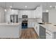 Modern kitchen with white cabinets, stainless steel appliances, and quartz countertops at 2410 Brantley Rd, Kannapolis, NC 28083