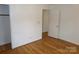 Spacious bedroom with hardwood floors and access to another room at 801 Anderson Rd, Albemarle, NC 28001