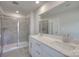 Bathroom with double vanity, quartz countertop, and walk-in shower at 105 Ciara Pl # A, Mooresville, NC 28117