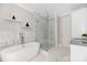 Spa-like bathroom featuring a soaking tub and a walk-in shower at 1162 S Kings Dr, Charlotte, NC 28207