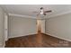 Bright bedroom featuring hardwood floors and ceiling fan at 1312 Crestfield Ct, Charlotte, NC 28269