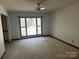 Bright living room with large window and carpet flooring at 1507 Springhaven Cir, Albemarle, NC 28001