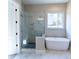 Bathroom with a walk-in shower, soaking tub and marble tile at 1865 Rock Hill Church Rd # 3, Matthews, NC 28104