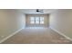 Bedroom with ceiling fan and large window at 1865 Rock Hill Church Rd # 3, Matthews, NC 28104