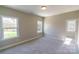 Bright bedroom with carpet and two windows at 1865 Rock Hill Church Rd # 3, Matthews, NC 28104