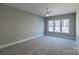 Spacious bedroom with ceiling fan and large windows at 1865 Rock Hill Church Rd # 3, Matthews, NC 28104
