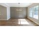 Bright dining room with a statement wall and chandelier at 1865 Rock Hill Church Rd # 3, Matthews, NC 28104