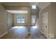 Two-story entryway with staircase, chandelier, and natural light at 1865 Rock Hill Church Rd # 3, Matthews, NC 28104