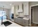 Modern kitchen with gray and white cabinets, herringbone backsplash, and stainless steel appliances at 1865 Rock Hill Church Rd # 3, Matthews, NC 28104