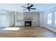Spacious living room with fireplace, built-in shelving, and hardwood floors at 1865 Rock Hill Church Rd # 3, Matthews, NC 28104