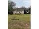 One-story house with tan siding and a brick chimney at 220 Woodside Dr, Wadesboro, NC 28170
