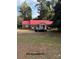 Ranch style brick home with red roof at 220 Woodside Dr, Wadesboro, NC 28170