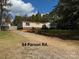 Single wide mobile home on a gravel driveway at 220 Woodside Dr, Wadesboro, NC 28170