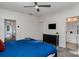 Bright bedroom with ensuite bathroom access and a view of the hallway at 4147 Merlane Dr, Charlotte, NC 28206