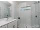 Clean bathroom with walk-in shower and subway tile at 4147 Merlane Dr, Charlotte, NC 28206
