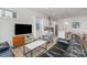 Open living room with kitchen view and comfy seating at 4147 Merlane Dr, Charlotte, NC 28206