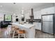 Modern kitchen with white cabinets and island at 4147 Merlane Dr, Charlotte, NC 28206