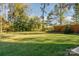 Spacious grassy backyard, offering plenty of space for recreation and relaxation at 4147 Merlane Dr, Charlotte, NC 28206