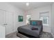 Cozy bedroom with plenty of natural light and a gray carpet at 4147 Merlane Dr, Charlotte, NC 28206