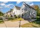 Row of modern houses with gray siding and green lawns at 4147 Merlane Dr, Charlotte, NC 28206