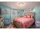 Charming bedroom with coral bedding and a teal accent wall at 4298 Maiden Hwy, Lincolnton, NC 28092