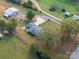 Aerial view of ranch home, detached garage, and surrounding land at 4298 Maiden Hwy, Lincolnton, NC 28092