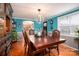 Bright dining room with hardwood floors and a large wooden table at 4298 Maiden Hwy, Lincolnton, NC 28092