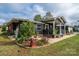 Home's exterior showcasing a combination of brick and gray siding, plus landscaping at 4298 Maiden Hwy, Lincolnton, NC 28092