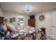 Primary bedroom with floral bedding and en-suite bathroom at 4298 Maiden Hwy, Lincolnton, NC 28092