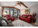 Relaxing living room with red leather sofas and hardwood floors at 4298 Maiden Hwy, Lincolnton, NC 28092