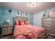Well-lit bedroom with coral bedding and wood accents at 4298 Maiden Hwy, Lincolnton, NC 28092