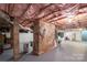 Unfinished basement area with storage and exposed brick at 4298 Maiden Hwy, Lincolnton, NC 28092