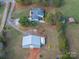 Aerial view showing a home and detached workshop on a large lot at 4298 Maiden Hwy, Lincolnton, NC 28092