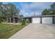 House exterior with a two-car garage and a well-manicured lawn at 4298 Maiden Hwy, Lincolnton, NC 28092