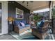 Relaxing front porch with wicker furniture and lush greenery at 4298 Maiden Hwy, Lincolnton, NC 28092