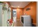 Bright laundry room with washer, dryer, and built-in storage at 4298 Maiden Hwy, Lincolnton, NC 28092