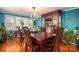 Formal dining room with a large wooden table, leather chairs, and hardwood floors at 4298 Maiden Hwy, Lincolnton, NC 28092
