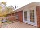 Back deck with French doors, a grill, and wooden railings at 8724 Old Plank Rd, Charlotte, NC 28216