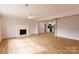 Spacious living room featuring a fireplace and wood-look flooring at 8724 Old Plank Rd, Charlotte, NC 28216