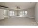 Spacious main bedroom with wall-to-wall carpet and large windows at 14944 Carbert Ln, Huntersville, NC 28078