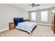 Bright bedroom with ceiling fan and neutral decor at 16404 Grassy Creek Dr, Huntersville, NC 28078