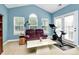 Home gym with an exercise bike and a comfortable seating area at 16404 Grassy Creek Dr, Huntersville, NC 28078