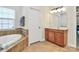 Primary bathroom with a large vanity and soaking tub at 16404 Grassy Creek Dr, Huntersville, NC 28078