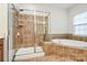 Bathroom features a shower and bathtub combo at 16404 Grassy Creek Dr, Huntersville, NC 28078