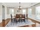 Bright dining room featuring hardwood floors and a chandelier at 16404 Grassy Creek Dr, Huntersville, NC 28078