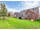 Brick home with deck and fenced-in backyard at 16404 Grassy Creek Dr, Huntersville, NC 28078