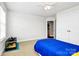 Spacious bedroom with a twin bed and double doors at 16404 Grassy Creek Dr, Huntersville, NC 28078