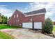 Two-car garage with basketball hoop at 16404 Grassy Creek Dr, Huntersville, NC 28078