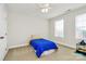 Small bedroom with a twin bed and large window at 16404 Grassy Creek Dr, Huntersville, NC 28078